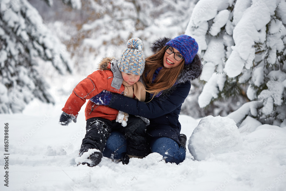 winter fun. a girl and a boy making snowballs. winter fun. a girl and a boy making snowballs.