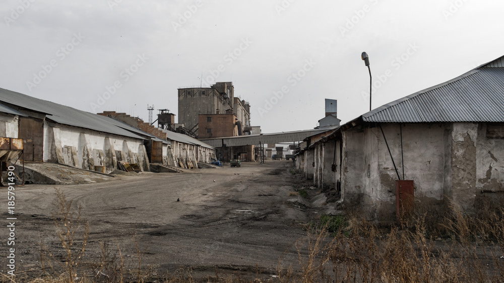 Old industrial buildings. Industrial background. Old architecture. Elevator