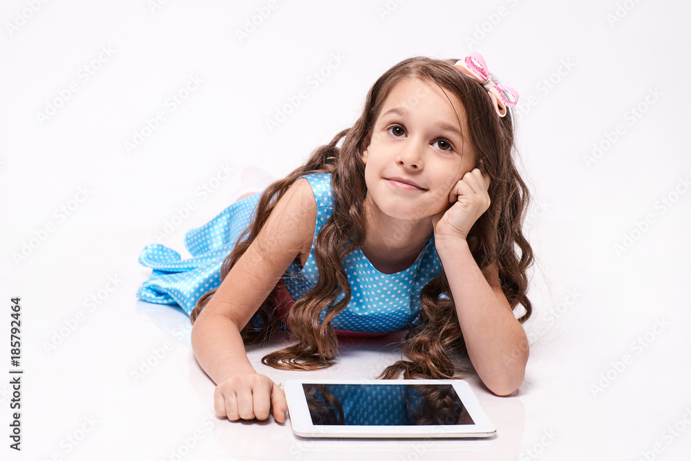 Computer tablet. Little girl. Modern technologies Computer tablet. Little girl. Modern technologies