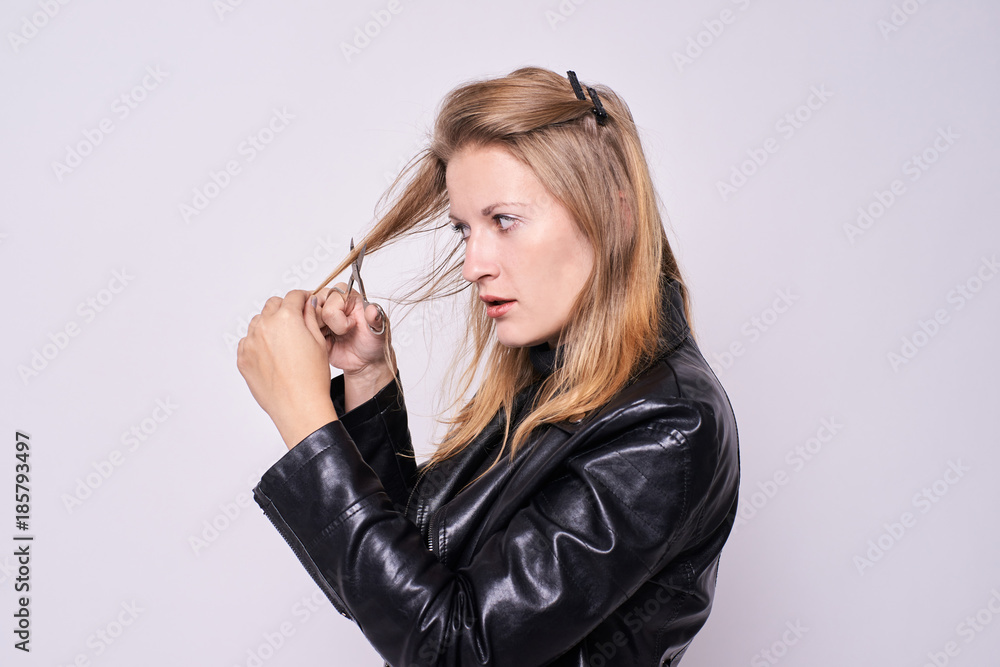 Girl hairdresser. To myself. Black jacket. White background Girl hairdresser. To myself. Black jacket. White background