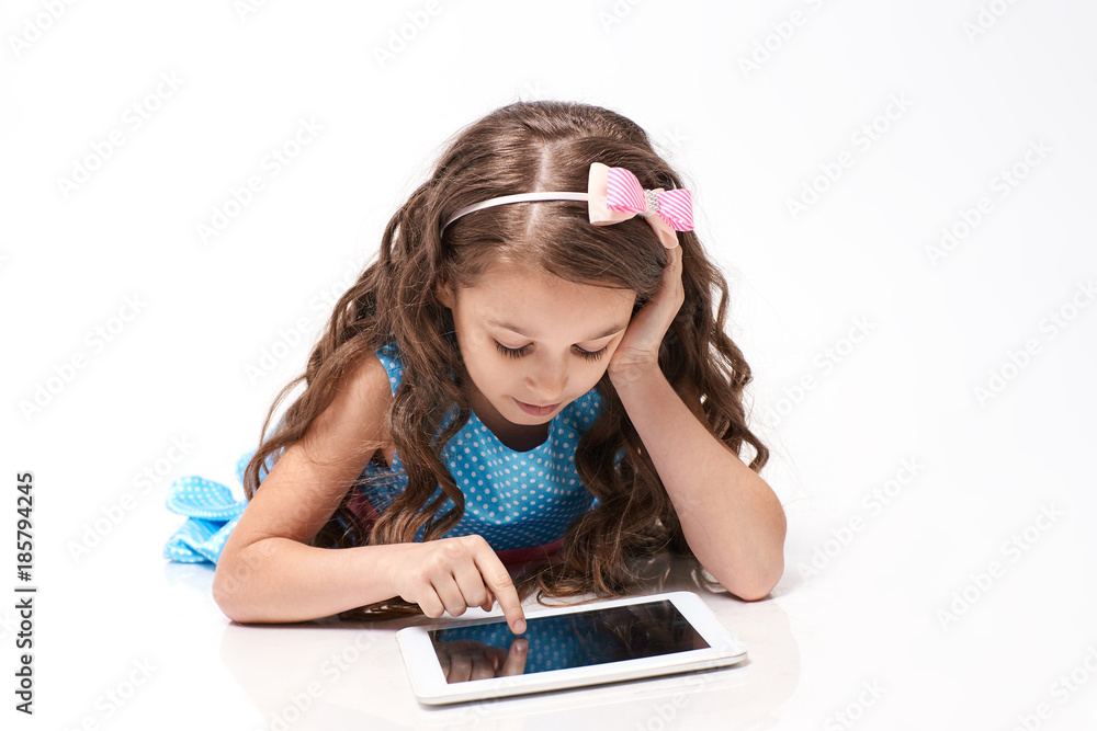 Little girl. Computer tablet. Modern technologies Little girl. Computer tablet. Modern technologies