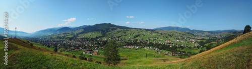 Carpatian mountains village at green forest