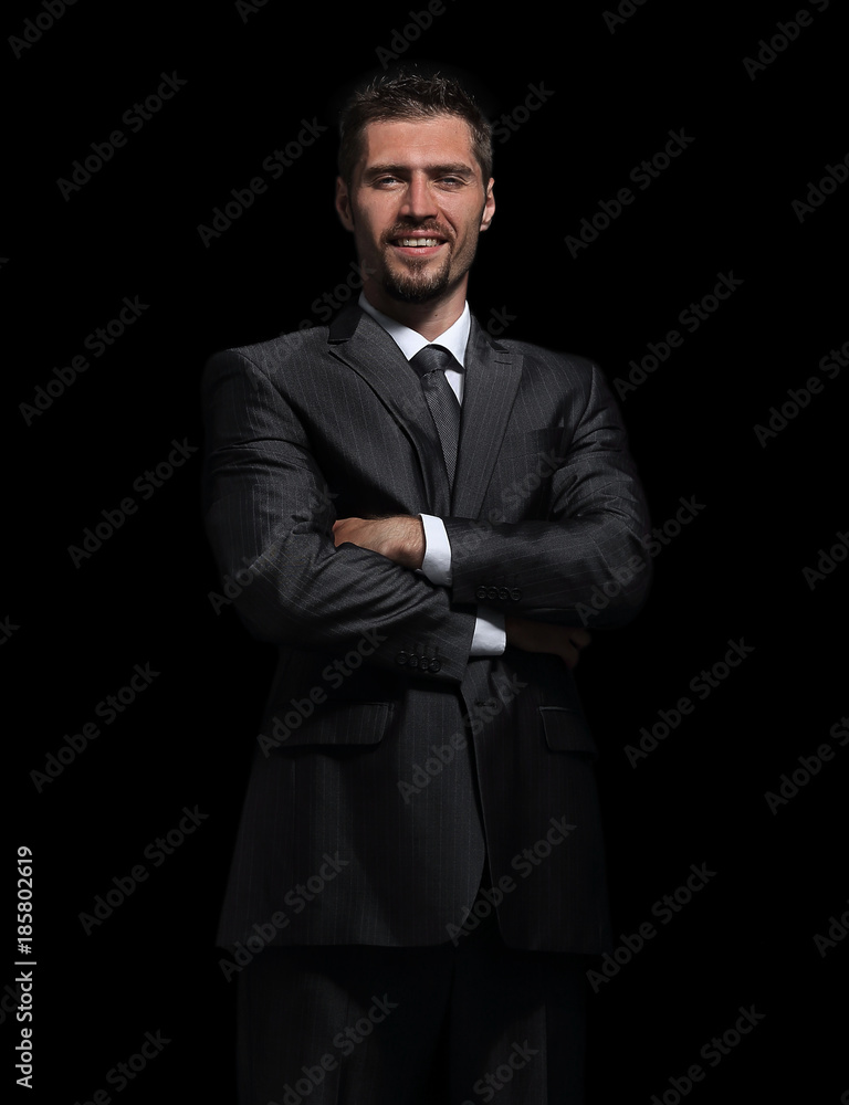 Handsome mature business man isolated on black background Handsome mature business man isolated on black background