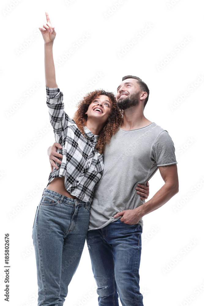 oung couple looking up and pointing upwards oung couple looking up and pointing upwards