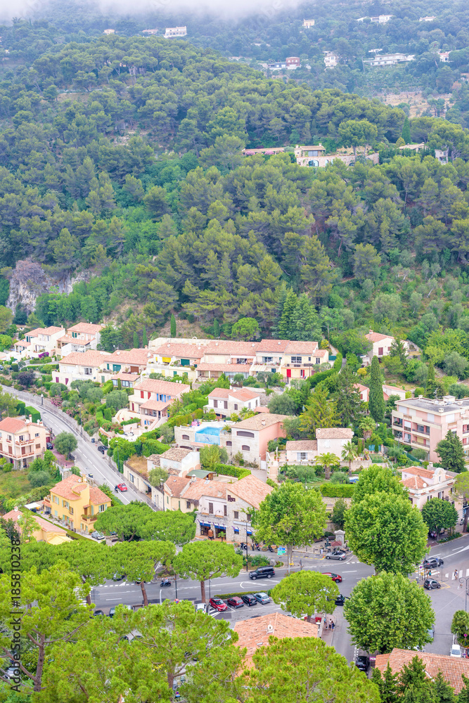 Daylight foggy view to Eze, Cote d'Azur village with medieval houses