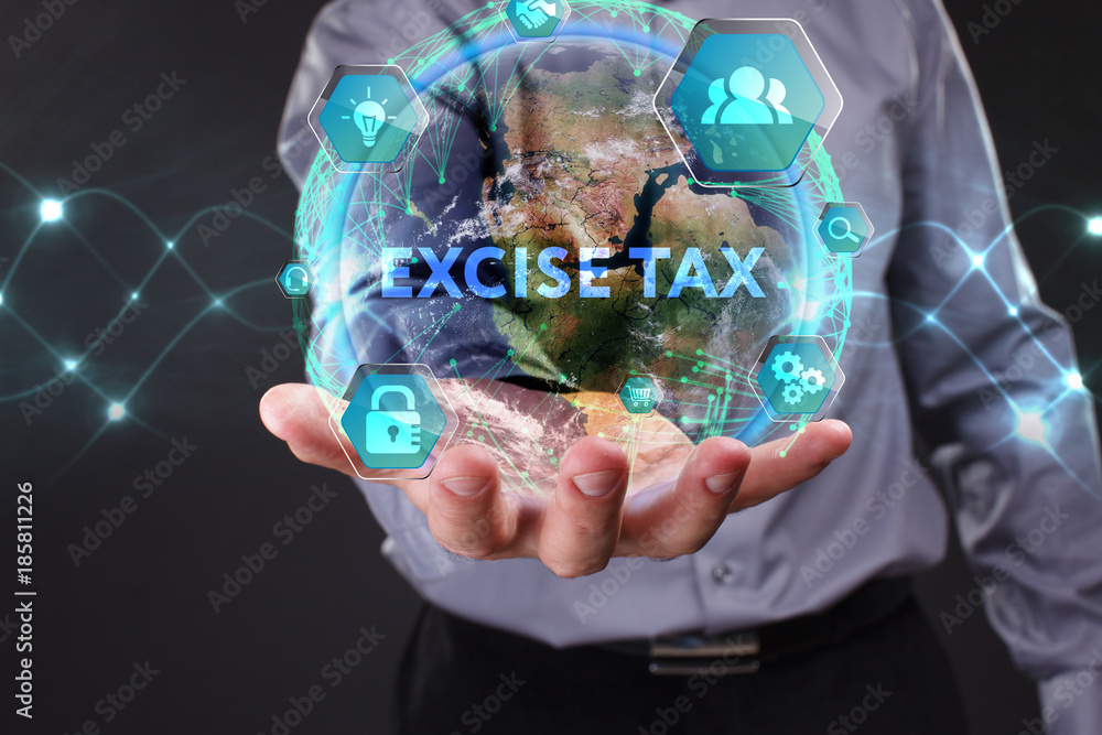 Fototapeta premium The conceptExcise tax of business, technology, the Internet and the network. A young entrepreneur working on a virtual screen of the future and sees the inscription: