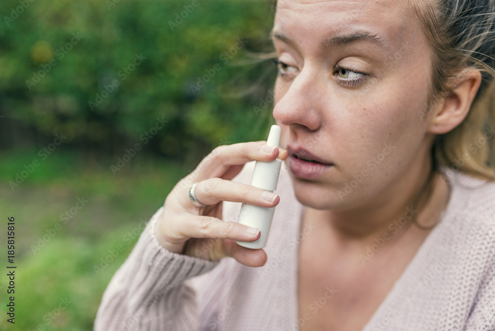 Illness And Sickness. Closeup Of Beautiful Woman Feeling Sick Dripping Nasal Drops In Blocked Nose. Portrait Female Sprays Cold And Sinus Medicine In Runny Nose. Sinusitis treatment. High Resolution Illness And Sickness. Closeup Of Beautiful Woman Feeling Sick Dripping Nasal Drops In Blocked Nose. Portrait Female Sprays Cold And Sinus Medicine In Runny Nose. Sinusitis treatment. High Resolution