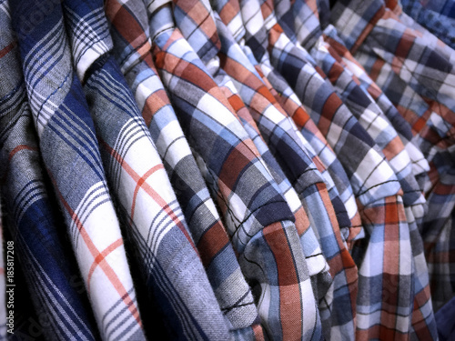 Patterned Shirts for Men Hanging on Rack in Clothing Store