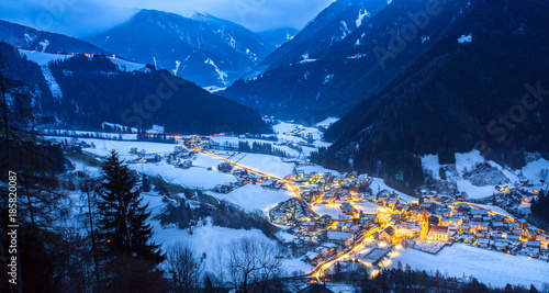 top view on snowy village luesen valley  at night south tirol Italy