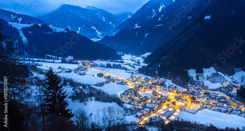 top view on snowy village luesen valley at night south tirol Italy
