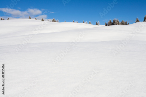 Winter background snow and blue sky landscape in south tirol Italy