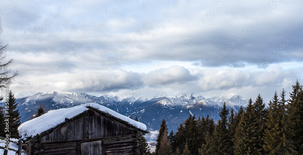 South tirol snow  mountains landscape and wood cabin winter travel