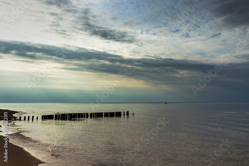 Fototapeta Naklejka Na Ścianę i Meble -  Abandoned fishing boat pier in Baltic sea at latvian coast.