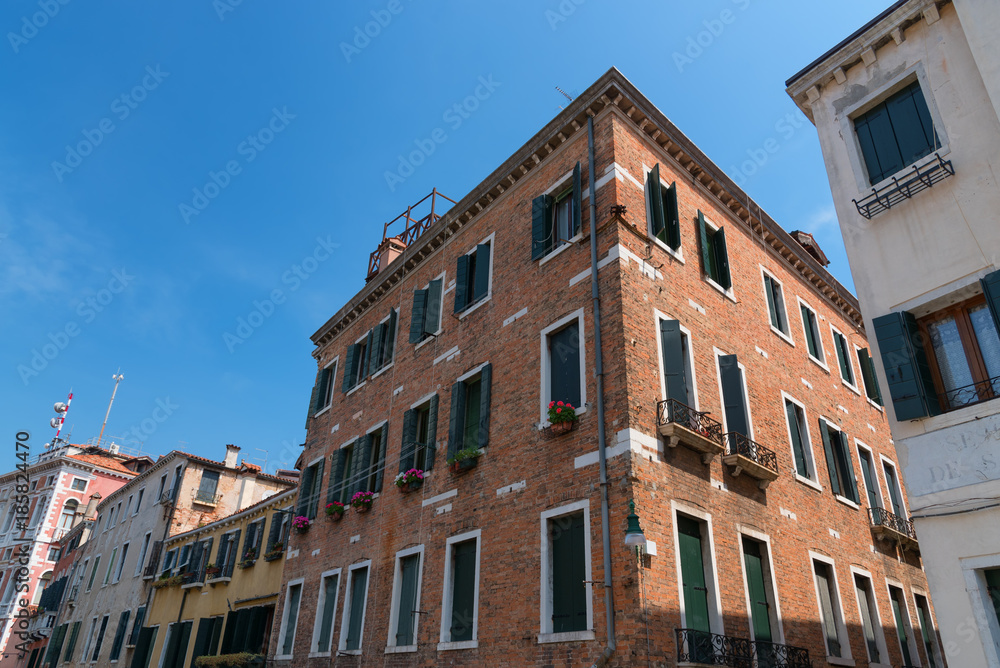 VENICE, ITALY – MAY 23, 2017: Traditional beautiful venetian houses in a sunny summer day.