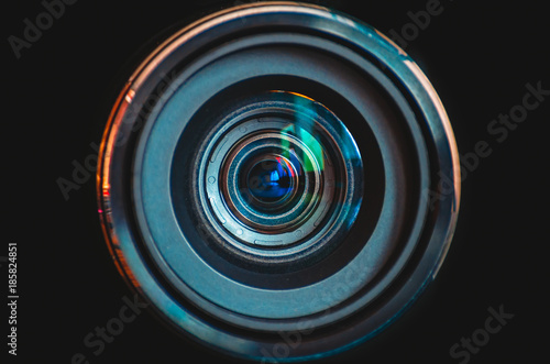 Konstfotografi Camera lens close up on black background