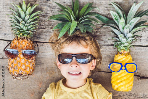 A pineapple boy and pineapples on vacation photo