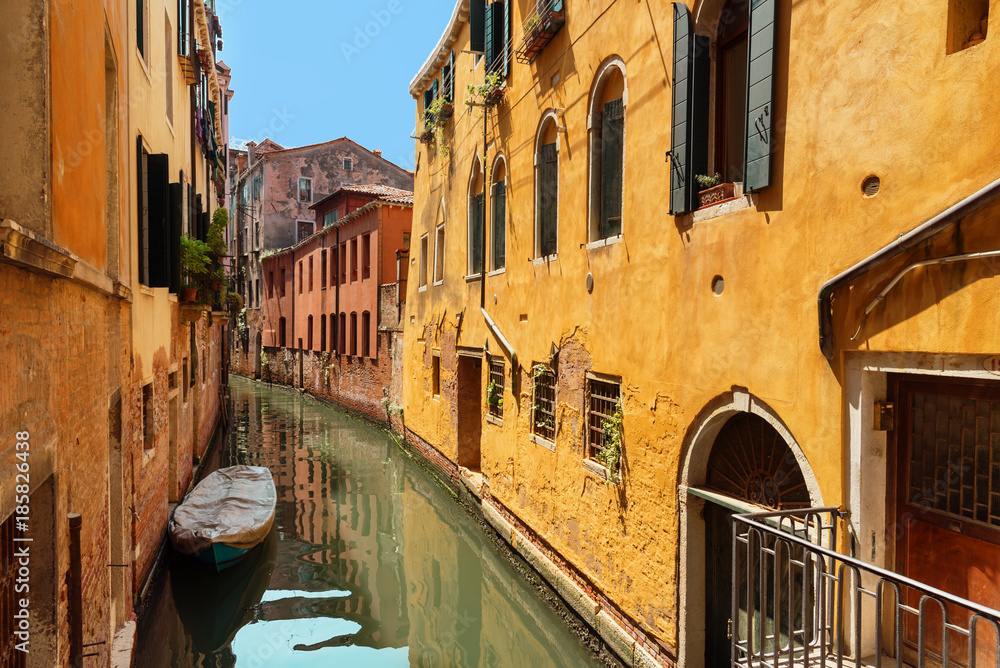 Traditional narrow canal street with gondolas and old houses in Venice, Italy. Architecture and landmarks of Venice. Beautiful Venice postcard. Traditional narrow canal street with gondolas and old houses in Venice, Italy. Architecture and landmarks of Venice. Beautiful Venice postcard.