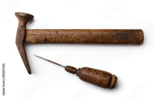 Fotografie Shoemaker's tool: a hammer and awl on a white background closeup