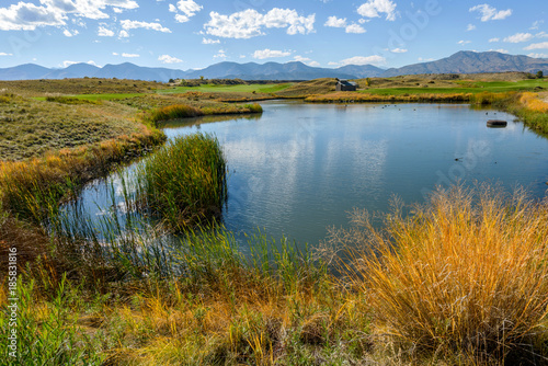 Autumn Mountain Pond - Autumn view of a small pond in Bear Creek Trail Park, Denver - Lakewood, Colorado. USA  photo