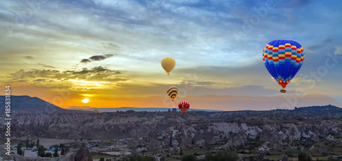 Hot air balloons sunset discovery Cappadocia, Anatolia, Turkey. Open air museum, Goreme national park.