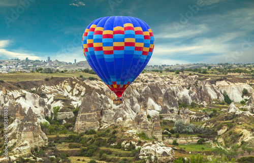 Hot Air balloons flying over Mountains landscape sunset Volcanic rocks, Cappadocia, Anatolia, Turkey. © Emoji Smileys People