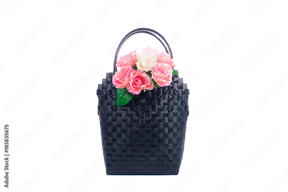 black wicker woman's tote bag with flowers, isolated on white background black wicker woman's tote bag with flowers, isolated on white background