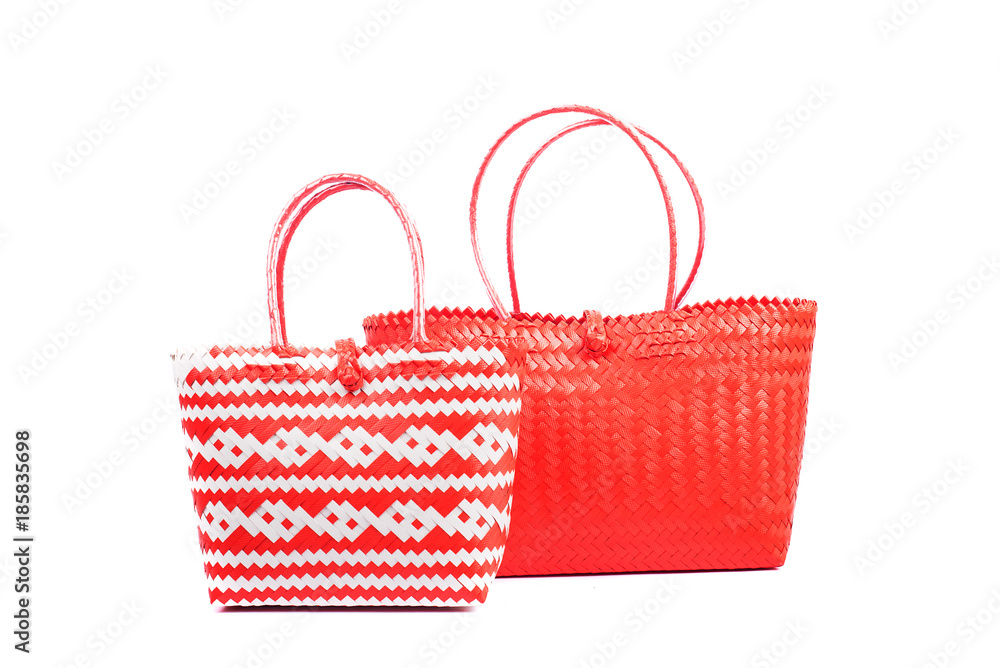 two red wicker woman's tote bags, isolated on white background two red wicker woman's tote bags, isolated on white background