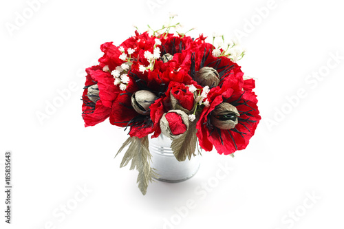Bouquet of paper poppies handmade with candies in a galvanized metal bucket as a gift