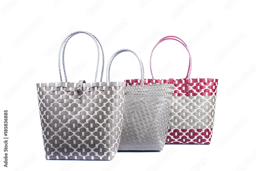 three wicker woman's tote bags, isolated on white background three wicker woman's tote bags, isolated on white background