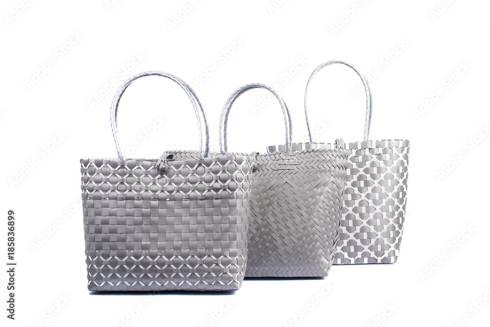 three grey wicker woman's tote bags, isolated on white background three grey wicker woman's tote bags, isolated on white background