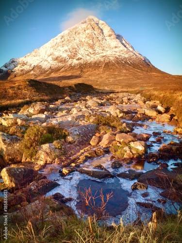 At river Coupall at delta to river Etive. Snowy cone of mountain Stob Dearg 1021 metres high.