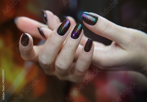 Stylish trendy female manicure. Nail design . Manicure nail paint . beautiful female hand with colorful nail art design manicure