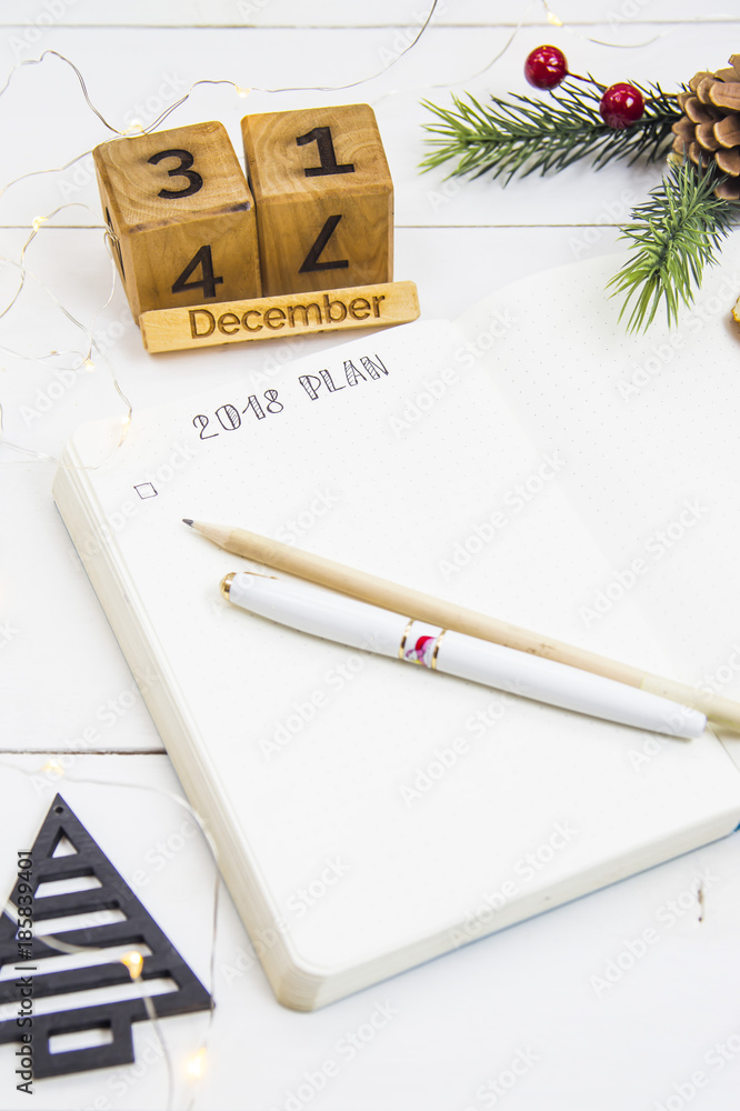 The setting of plans and goals for 2018 in the diary during the New Year holidays The setting of plans and goals for 2018 in the diary during the New Year holidays