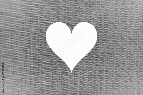 Grey shabby chic fabric horizontal love card design. White cut off heart shape in gray textile surface.
