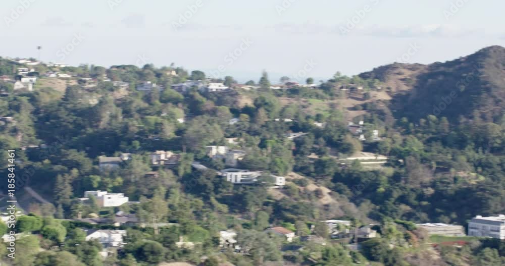 Pan across the Hollywood Hills in Los Angeles, California, USA. Ends looking towards Century City from Mulholland Drive. 4K. Pan across the Hollywood Hills in Los Angeles, California, USA. Ends looking towards Century City from Mulholland Drive. 4K.
