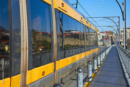 View of metro train with yellow stripes. Porto