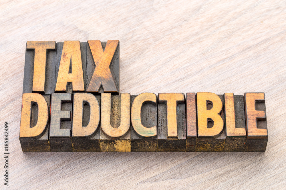 Fototapeta premium tax deductible word abstract in wood type