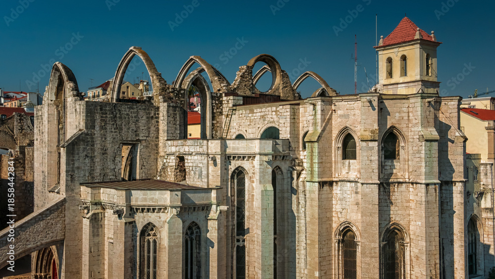 Telephoto shot of the Convento do Carmo, Convent of Our Lady of Mount Carmel, in Lisbon, Portugal. The Gothic Igreja do Carmo bears the scars of the 1755 earthquake which destroyed the downtown