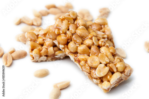 A side view of a two gozinaki dessert bars with peanuts