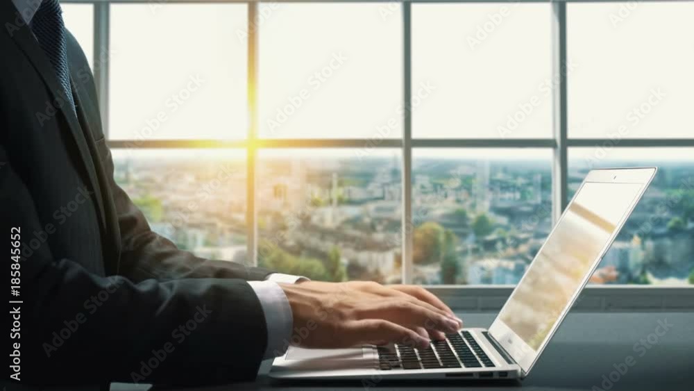 View of Bochum Germany.Close up hand Businessman using laptop View of Bochum Germany.Close up hand Businessman using laptop