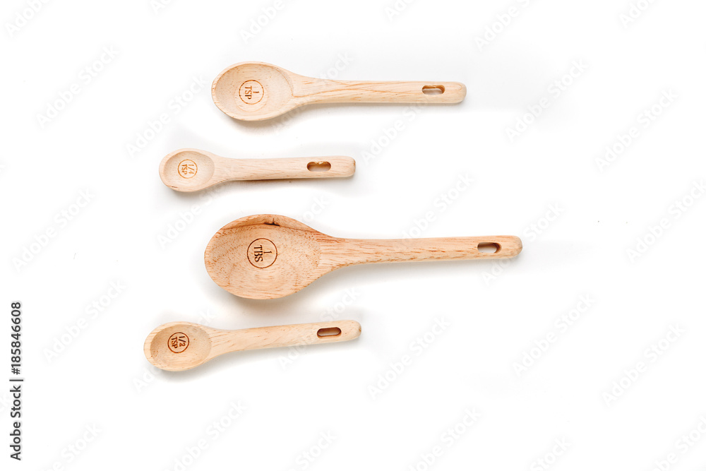 Bamboo measuring spoons on a white background Bamboo measuring spoons on a white background