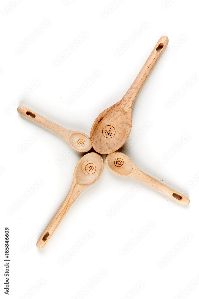 Bamboo measuring spoons on a white background Bamboo measuring spoons on a white background