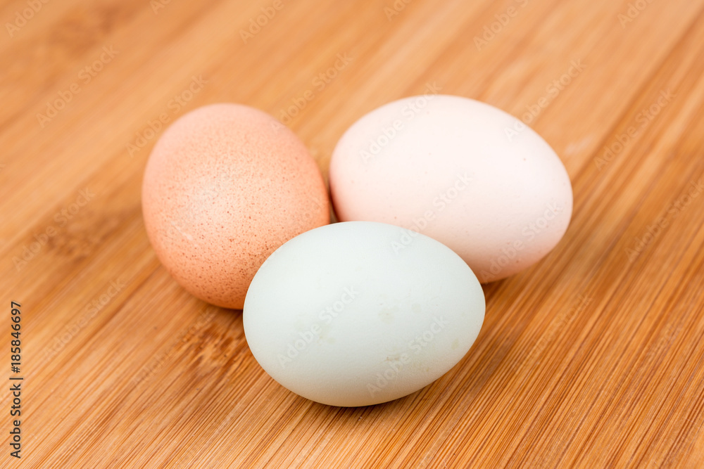 Farm fresh eggs on a wood background Farm fresh eggs on a wood background