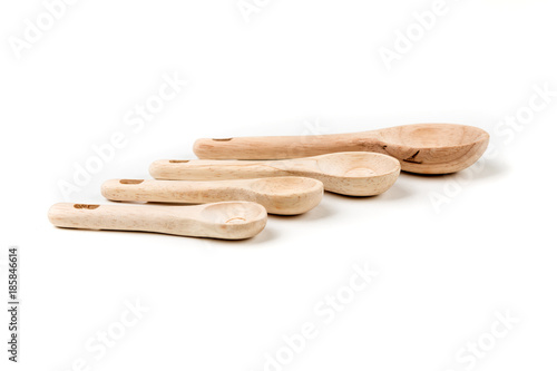 Bamboo measuring spoons on a white background photo