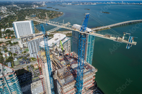 Highrise architecture under construction with cranes aerial image photo