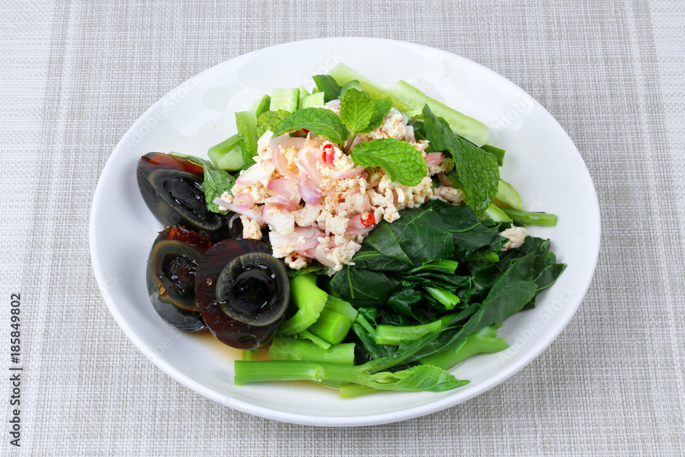 Spicy cucumber salad with dried shrimp and preserved egg. Spicy cucumber salad with dried shrimp and preserved egg.