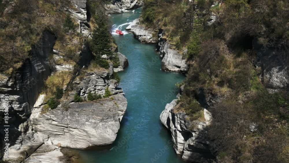 high angle long shot of the shotover jet in a canyon near queenstown- recorded at 1080p 60fps high angle long shot of the shotover jet in a canyon near queenstown- recorded at 1080p 60fps