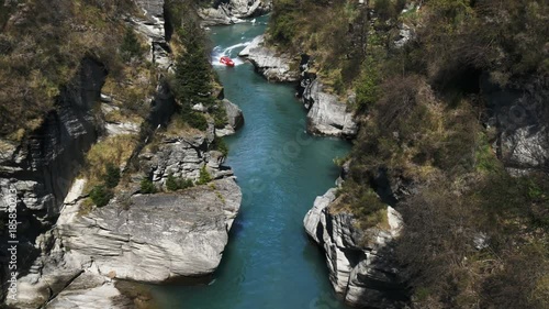 high angle long shot of the shotover jet in a canyon near queenstown- recorded at 1080p 60fps photo