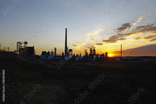 Industrial plant equipment in the sunset