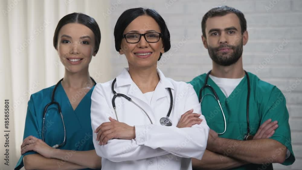 Medical staff smiling at camera, health care system and insurance reform policy Medical staff smiling at camera, health care system and insurance reform policy